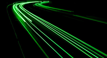 green car lights at night. long exposure