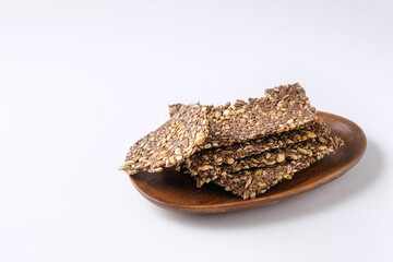 healthy seed crackers on white background