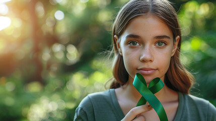green ribbon symbol of fight against disease. World lymphoma awareness day. September 15. Liver, Gallbladders bile duct, kidney Cancer and Lymphoma Awareness month or Celiac disease awareness. - obrazy, fototapety, plakaty