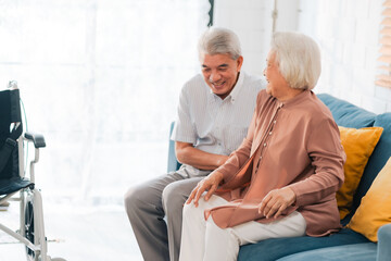 A happy elderly couple in retirement receives loving care and support from family and professional caregivers at home, ensuring health and smiles.
