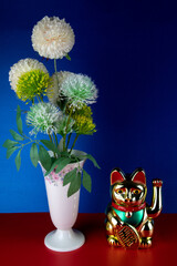 Artificial Flowers in a Porcelain Vase with Gold Coloured Maneki Neko Waving Lucky Cat - 763967964
