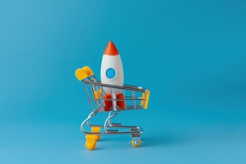 Rocket and shopping cart, startup concept, online store and shopping, blue background.