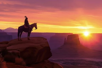 Rolgordijnen Silhouette of Indian on horseback on top of a cliff, sunset in the background, wild west concept. © Deivison