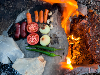 delicious food over wood fire and on stone - 763990938