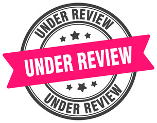 under review stamp. under review label on transparent background. round sign