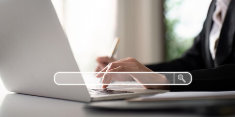 Search technology, search engine optimization, businesswoman using laptop to search information, using search bar function on your website