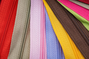 Multicolored Zippers or Zip Fasteners used for binding fabric or textile