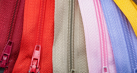 Multicolored Zippers or Zip Fasteners used for binding fabric or textile