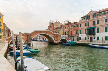 Venice, Italy. Picturesque Venetian landscape with old Italian houses and a bridge Ponte dei Tre Archi.