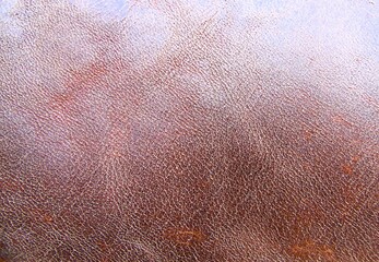 Texture of light brown suede leather close-up