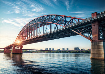 Fototapeta premium Bridge over a clear river by the city