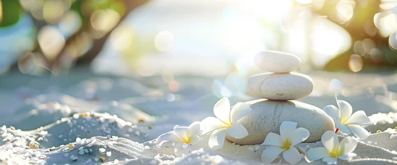 Photo sur Plexiglas Pierres dans le sable Zen stones and frangipani blossom on the beach