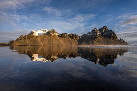 The reflection of VESTRAHORN, The great of mountain at Hofn, Iceland in the morning