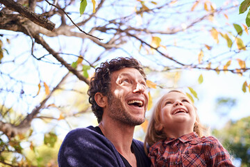 Father, daughter and excited in garden in autumn with trees, leaves and healthy childhood...