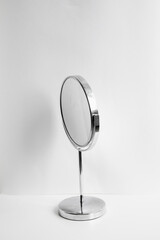 Desktop round make-up mirror on white background