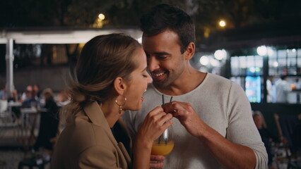 Happy pair tasting alcohol having fun on date closeup. Romantic partners drink