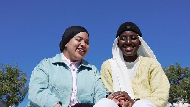 Portrait smiling generation z muslim girls. Friendship Islamic young women.
