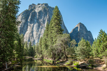 Middle Cathedral Rock and Yosemite Valley in Yosemite National Park during September in California. Formed in 1890 this is one of the oldest and most famous National Parks in the United States. - 764041519