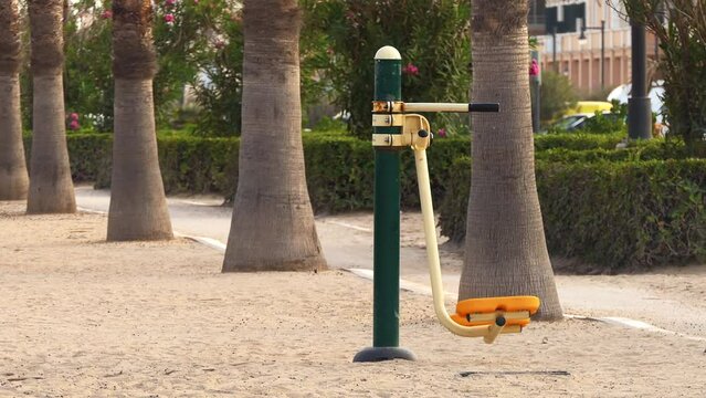 outdoor exercise machine step on the sandy beach in Valencia, Spain
