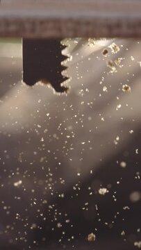 Discover the artistry of woodworking with our captivating slow motion footage capturing the delicate movements of a jigsaw as it skillfully carves through wood. Perfect for showcasing the precision an