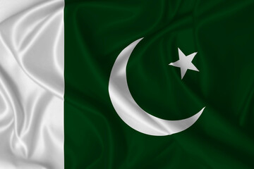 Flag of Pakistan waving in the wind on fabric texture