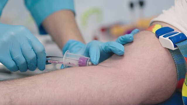 Close up shot of healthcare worker specialist hands in protective gloves making vaccination to patient, nurse hand injecting vaccine into patient arm in hospital lab, vaccination, injection concept