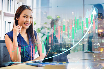 Double exposure of stock market graph and business woman working on laptop computer at office. financial stock exchange marketing concept.	 - 764056164