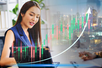 Double exposure of stock market graph and business woman working on laptop computer at office. financial stock exchange marketing concept.	