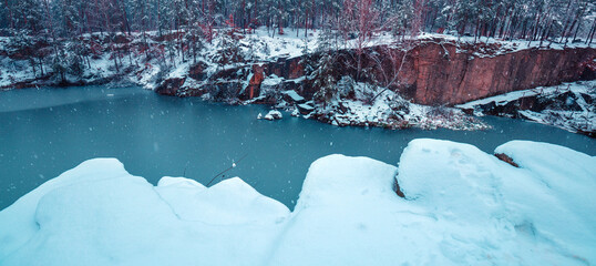 The lakeshore is covered with snow in winter. View of the beautiful lake in snowy winter. Horizontal banner - 764056909