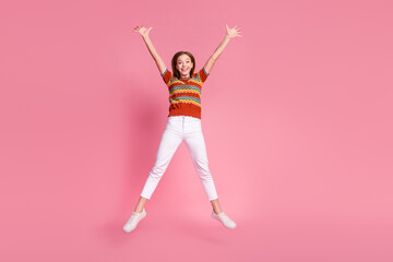 Full body portrait of lovely nice person jumping raise hands empty space isolated on pink color...
