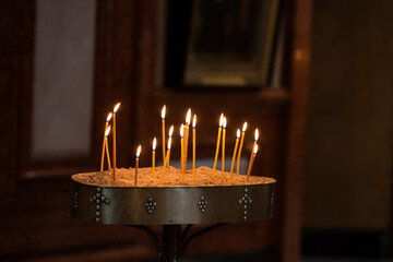 Candles lit by worshippers in a church in Tbilisi, Republic of Georgia - obrazy, fototapety, plakaty