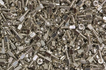 Hex Jackscrew Standoff spacer screws PCB pillar style scattered loosely electronics and computer hardware.