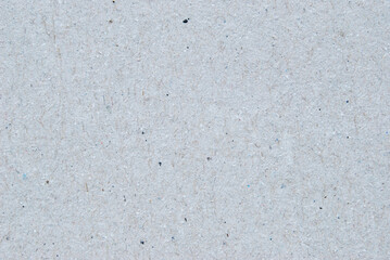 A sheet of gray recycled cardboard texture as background