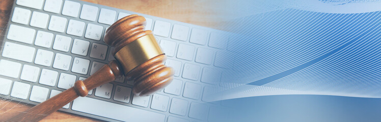 Gavel on keyboard, legal law concept