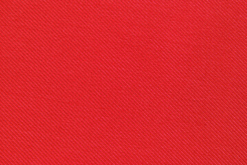 Red cotton twill fabric pattern close up as background