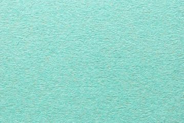 A sheet of green rough cardboard texture as background
