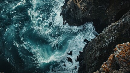 Aerial view of tumultuous sea waves crashing against rocky cliffs - obrazy, fototapety, plakaty