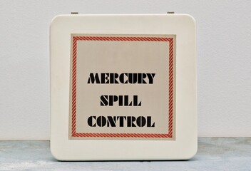 Closed Mercury spill control kit box on shelf, hazardous danger science laboratory safety equipment concept.	