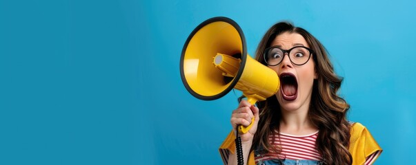 Woman shouting with a megaphone on blue background - obrazy, fototapety, plakaty