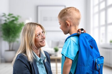 Mother helping child ready for school,