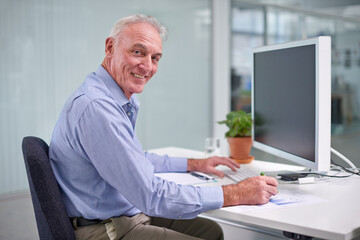 Senior, businessman and computer for portrait at desk, worker or internet technology in office for digital job. Professional male person, online for corporate career, happy employee in workplace