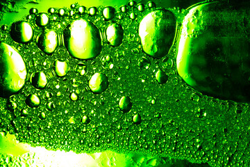 Green macro bubble texture,Light Green Background Closeup of Oil Drops in Water. Abstract Macro Photo of Liquid Surface with Bubbles. Bright Design of Structural Watery Texture