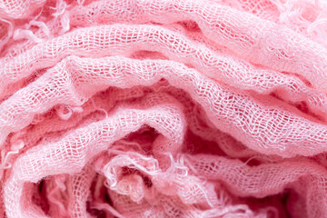 Pink cloth roll,Macro close range,Pile of folded pink blankets. Rolls of pink plaids lie on a shelf, texture effect.