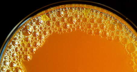Macro orange juice texture,Diet healthy nutrition. Fresh yellow fruits juice background texture. Orange water bubbles. Macro