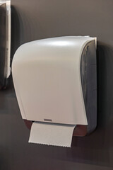 White Plastic Box Hand Paper Towel Dispenser at Black Wall