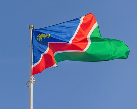 National Flag of Namibia at Sunny Day Blue Sky