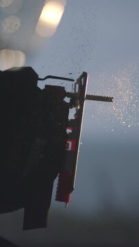 Feel the pulse of woodworking come alive in our 4K vertical slow motion video. Witness the exhilarating moment as an electric jigsaw ignites into action, sending wood chips flying in a mesmerizing dan