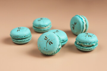 Colorful french dessert macarons with fresh fruits and nuts.