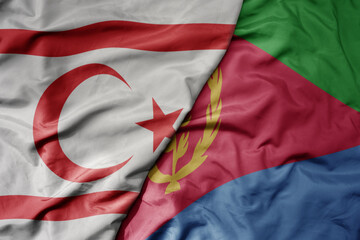 big waving national colorful flag of eritrea and national flag of northern cyprus.