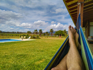 Person on paraguayan hammock at countryside landscape - 764107970